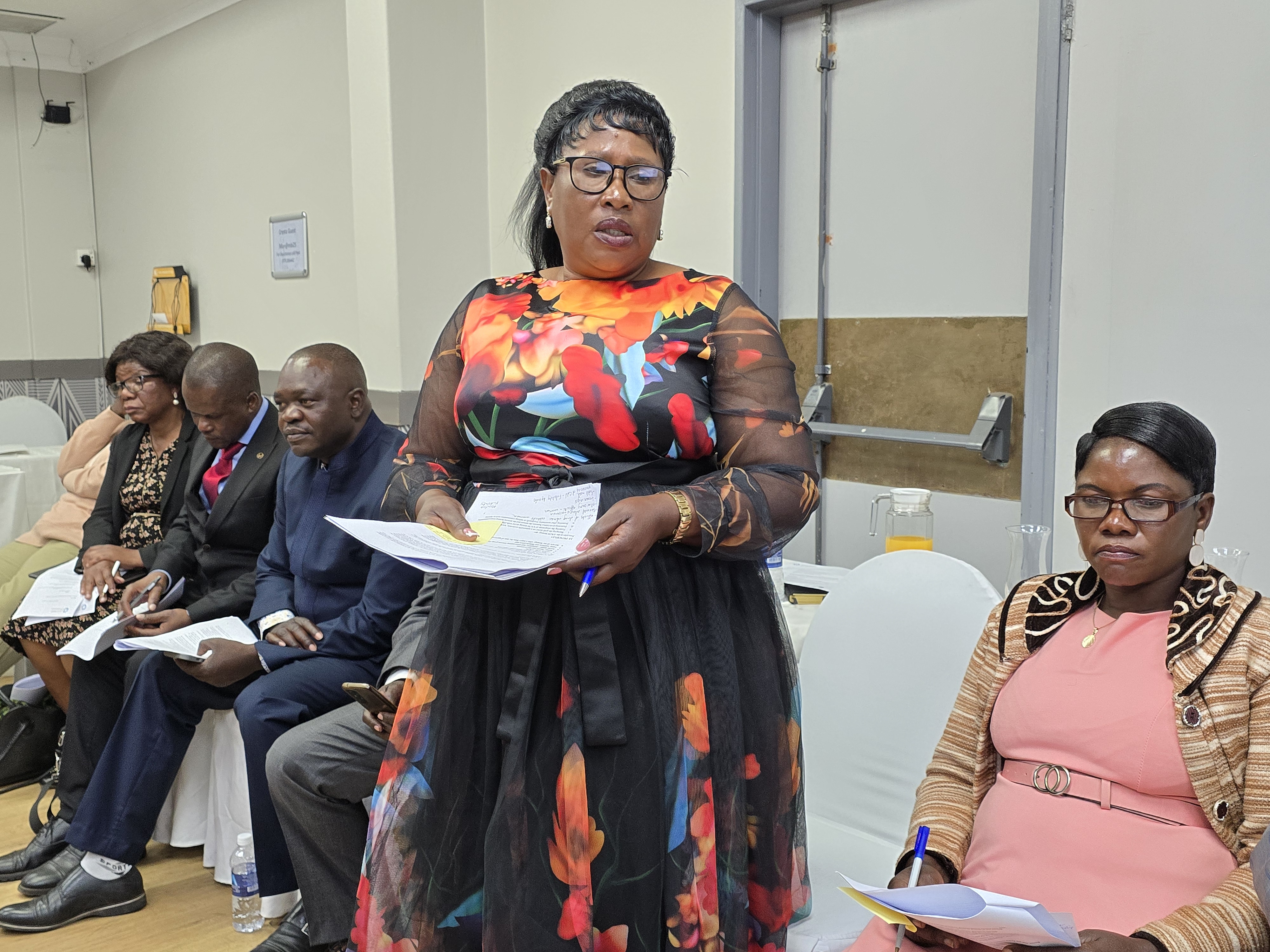 A women miner presents her response to the proposed ASGM strategy