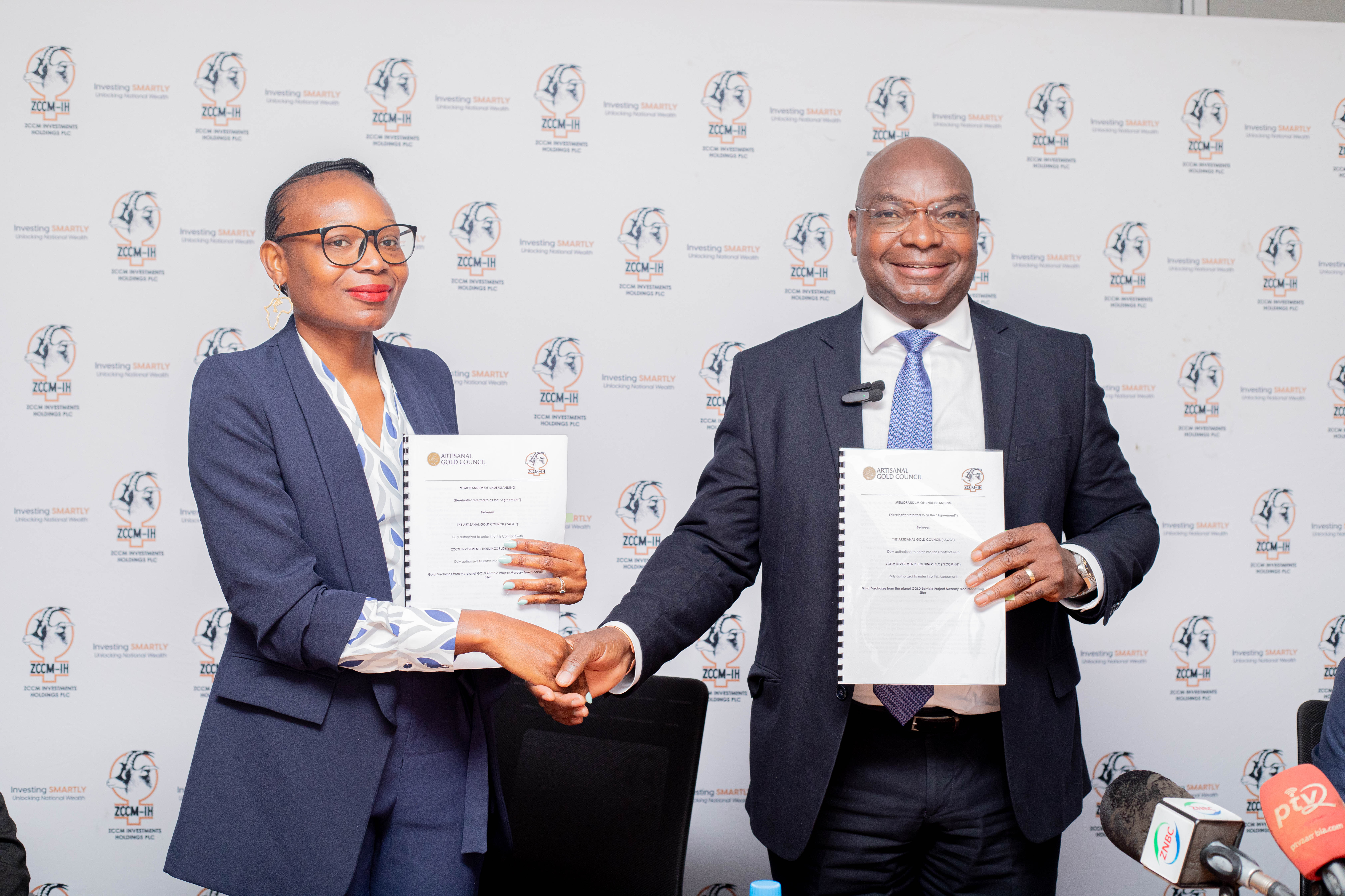 Exchange of Document greeting between ZCCM-IH CEO and The planetGOLD Zambia National Project Manager