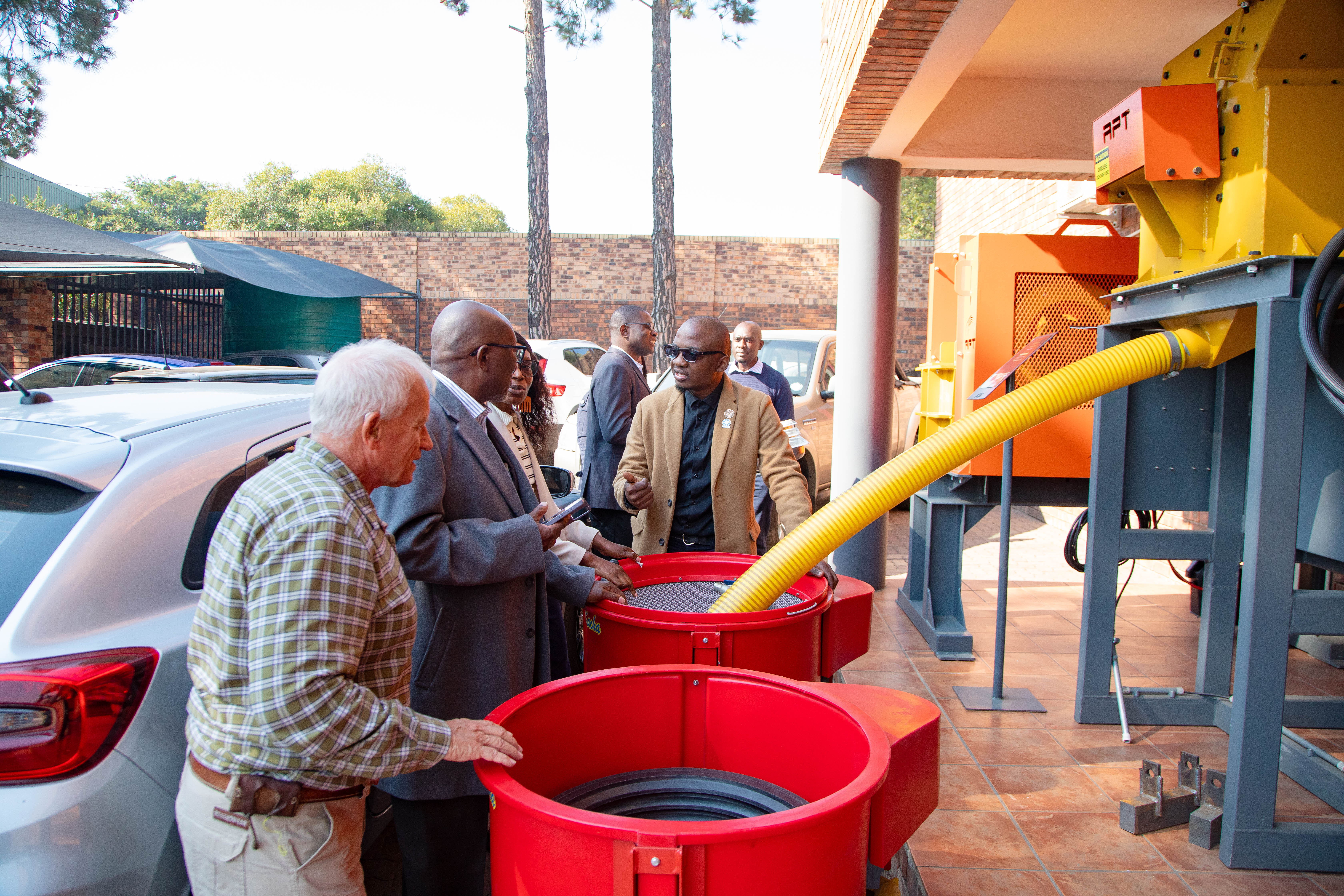 The team Inspecting equipment at APT