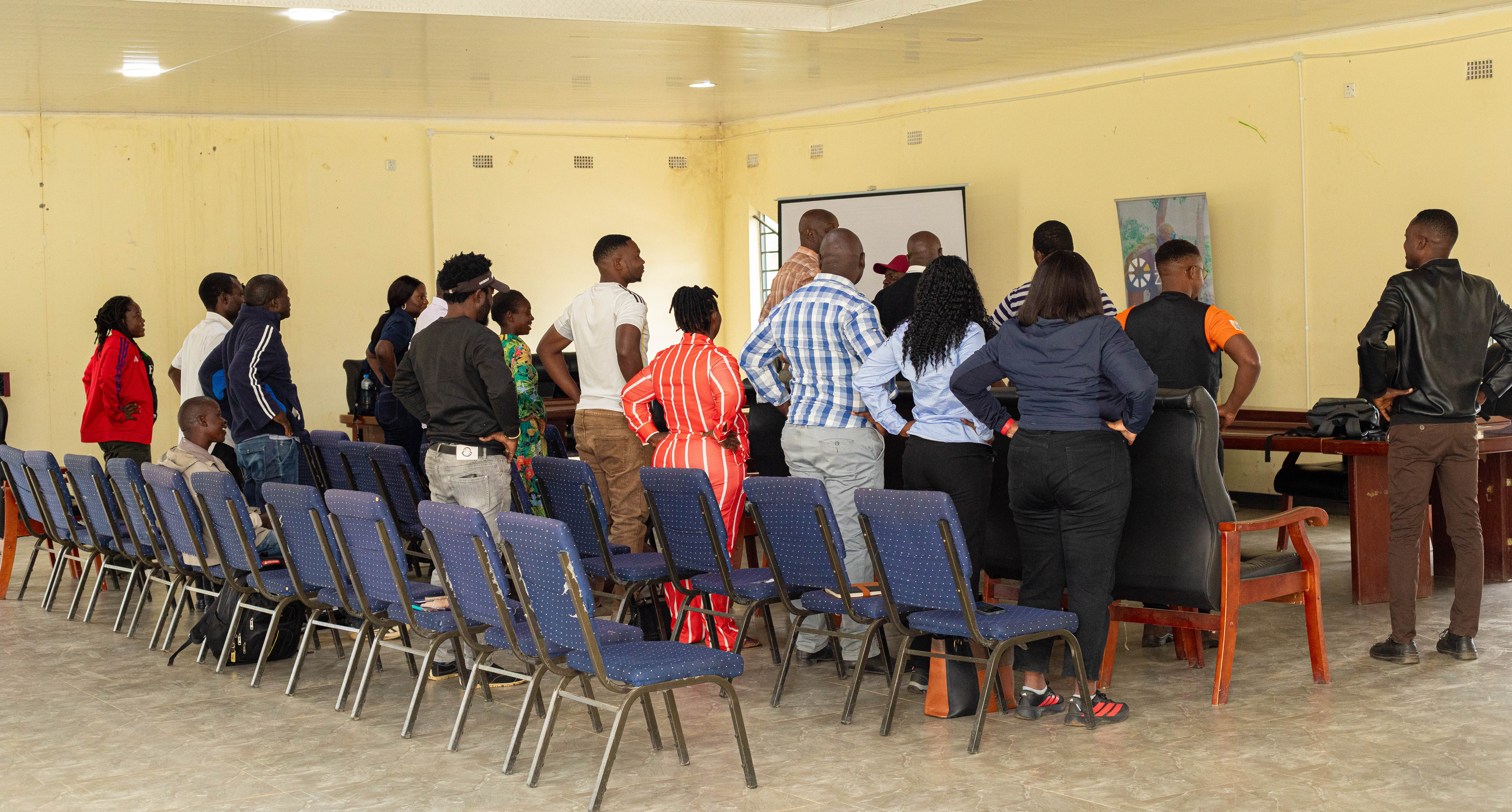 Participants participating in an ice breaker session during the Financial Literacy Training in Chisamba District