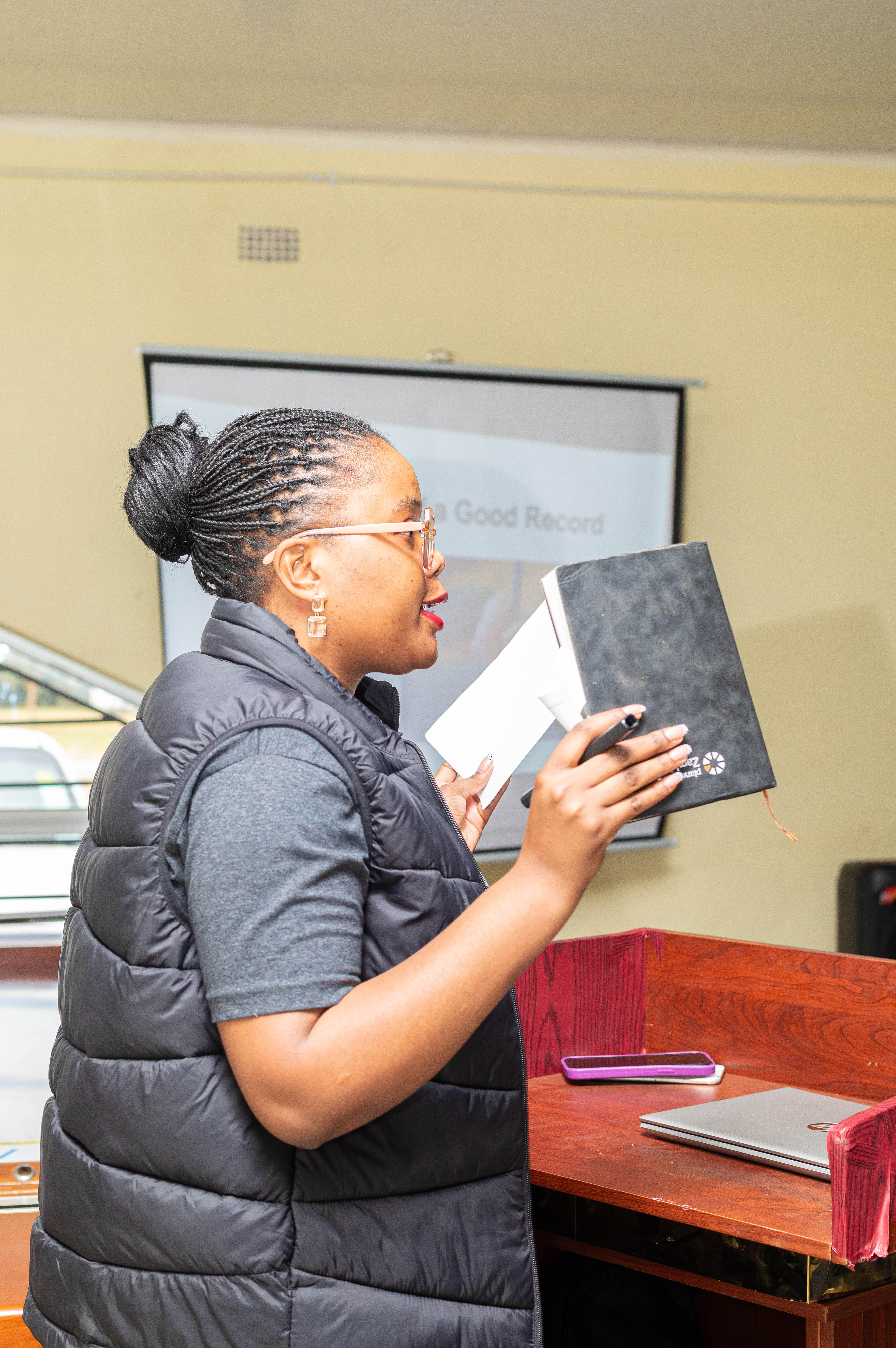 Ms. Audrey Wangwe conducting a lesson on Record Keeping during the Financial Literacy Training in Chisamba District
