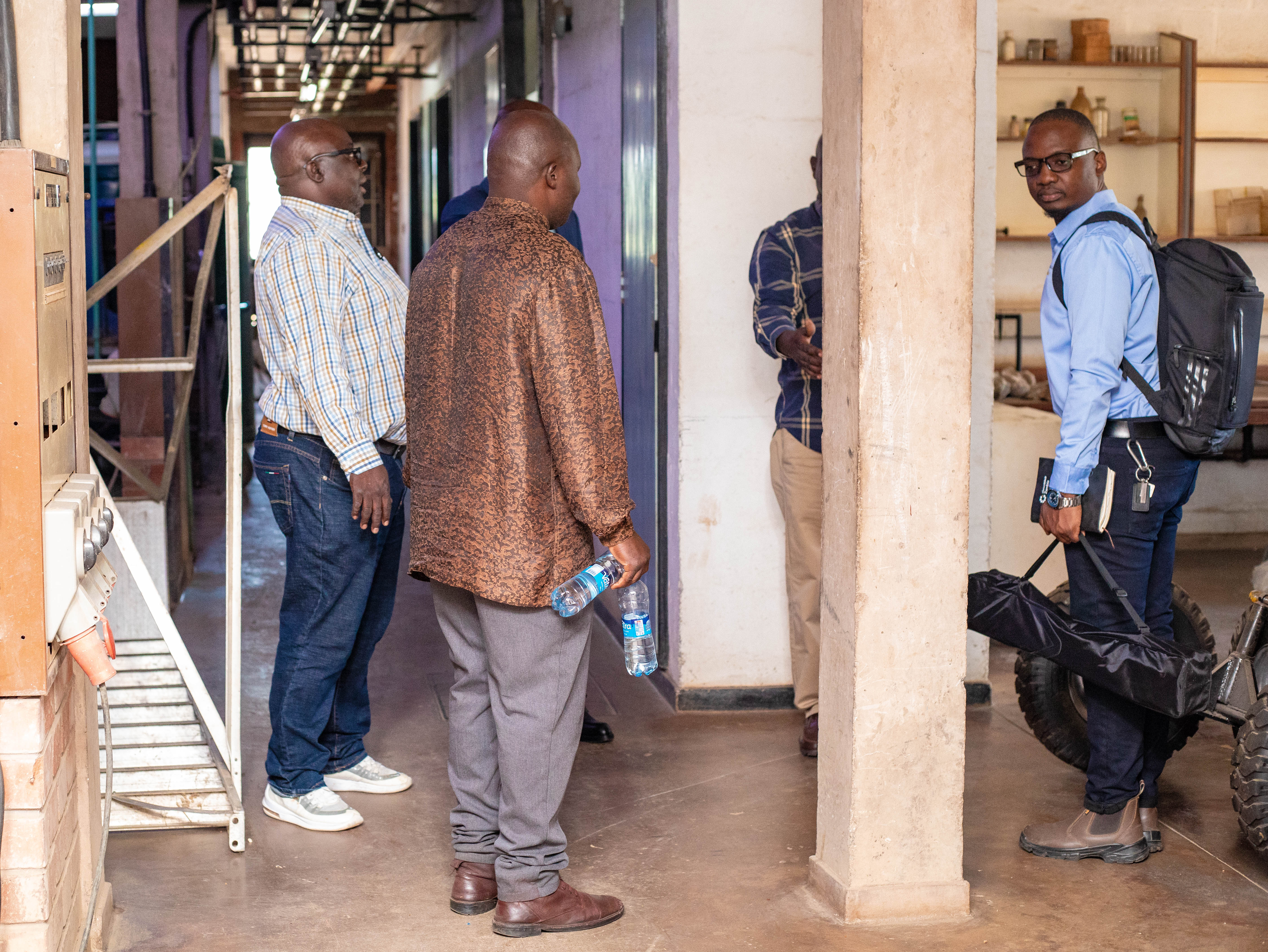 the planetGOLD Zambia Project team touring UNZA Metallurgical Engineering laboratory