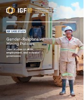 woman miner standing next to truck