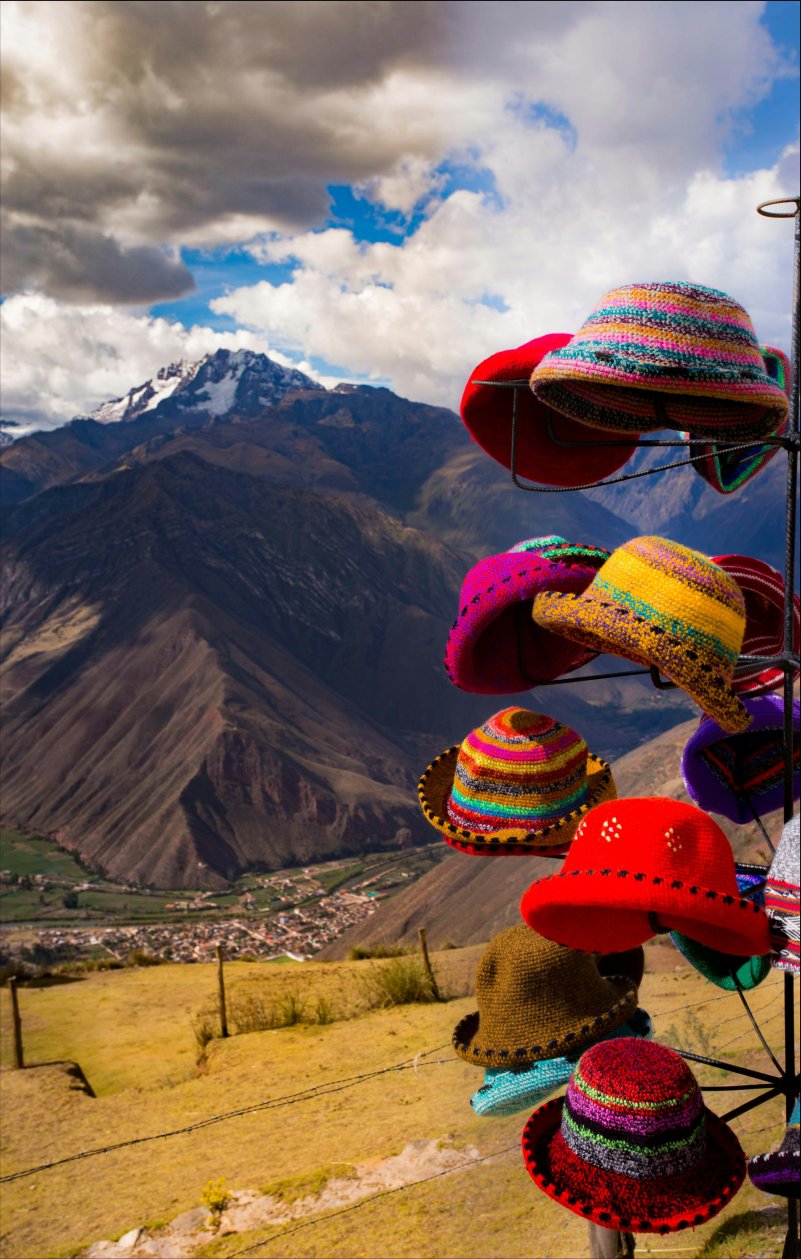 A collection of hats on a hanger