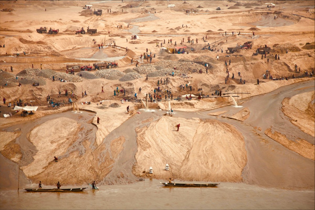 a sandy landscape with people in a distance