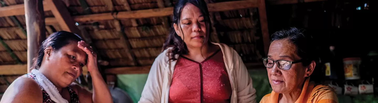 Women with ledger in Philippines
