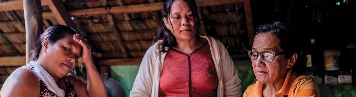 Women with ledger in Philippines
