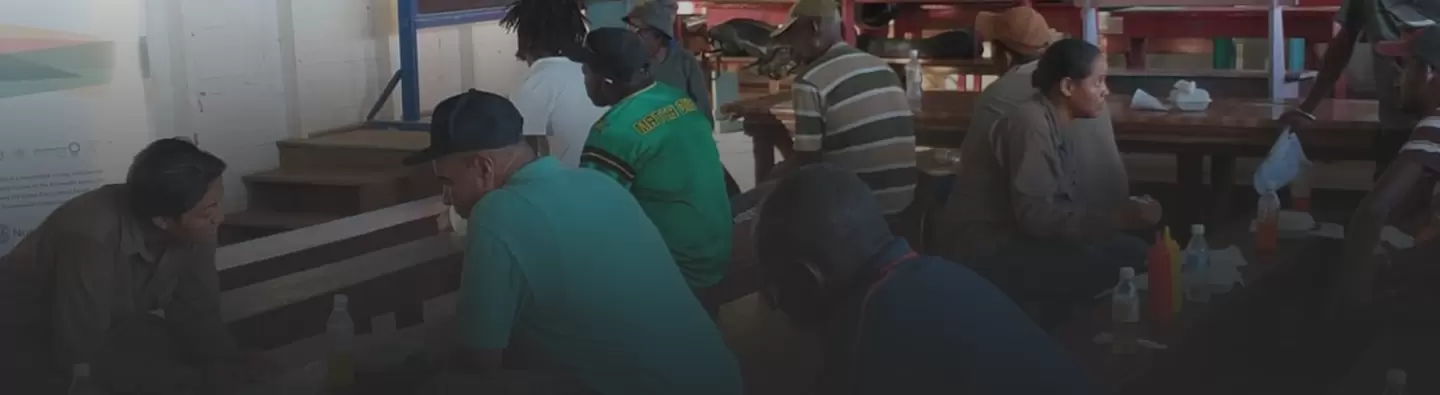 Project staff speak with miners in Guyana
