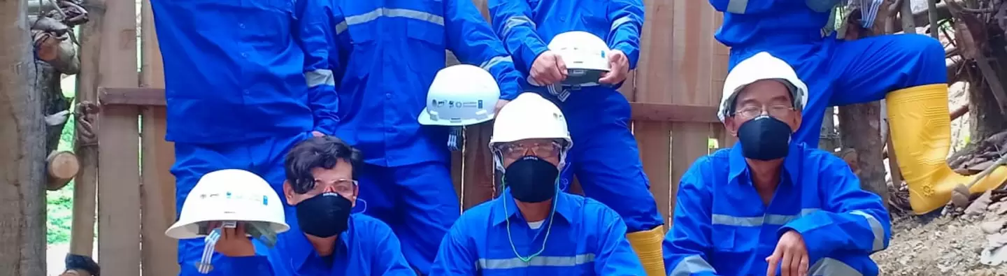 Miners in West Lombok, Indonesia using PPE at mining location