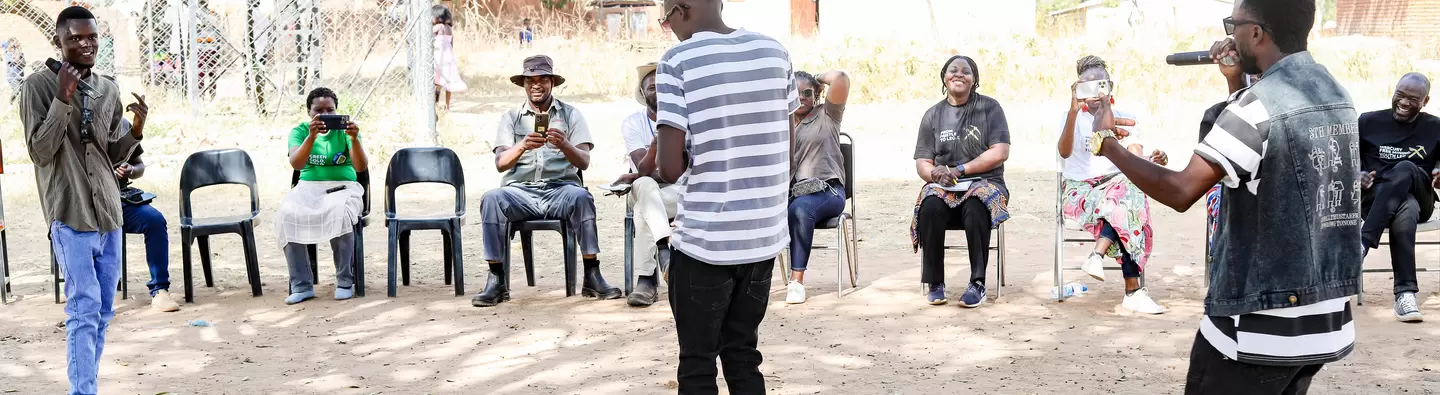 The Big Team Music performing one their songs during an engagement