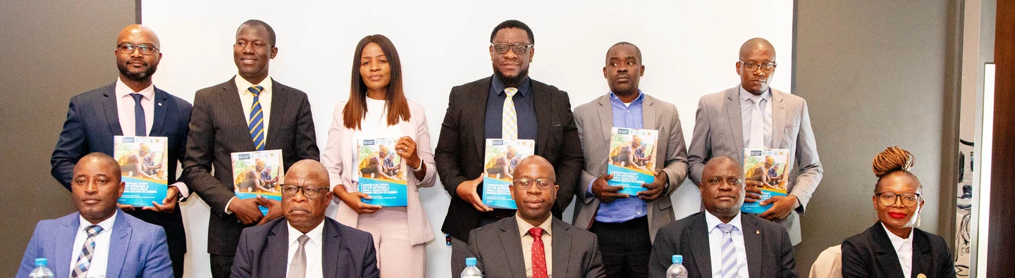 Stakeholders posing for a group photo with the Contextual Study Report