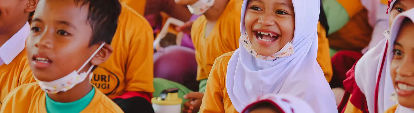 Students in Indonesia listening to stories on dangers of mercury