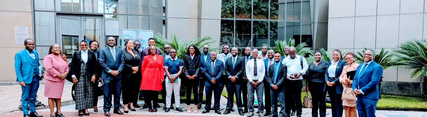 Financial institutions, stakeholders and the planetGOLD Team posing for photo after a succesful meeting