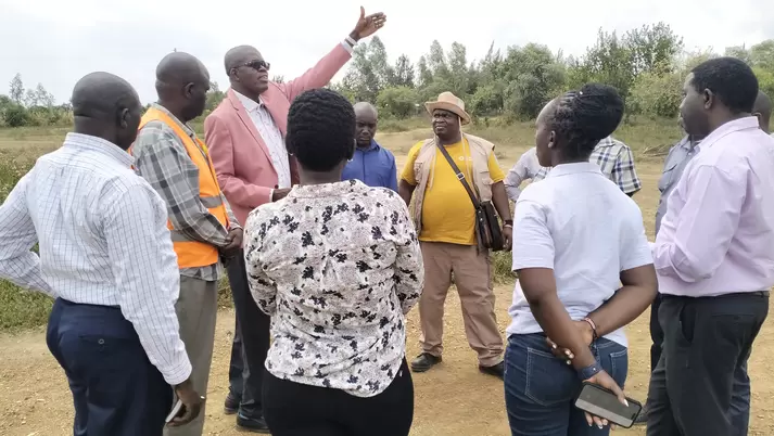 Environment Director of Migori County, Kenneth Ombogoh, inspecting the land the county is proposing for setting up the mercury free demonstration site