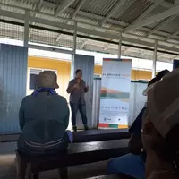 Project rep speaking to miners