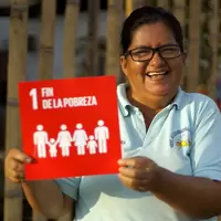 Person holding SDG 1 sign
