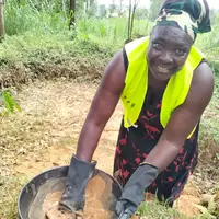Mary Alwanyi processing gold in her homested