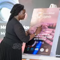 Hon Ruth Nankabirwa signs project poster