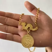 The jewelry piece that features the logo of the Local Government Unit of Paracale and the newest attraction in town during this time - the Uni-dragon.