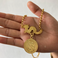 The jewelry piece that features the logo of the Local Government Unit of Paracale and the newest attraction in town during this time - the Uni-dragon.
