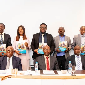 Stakeholders posing for a group photo with the Contextual Study Report