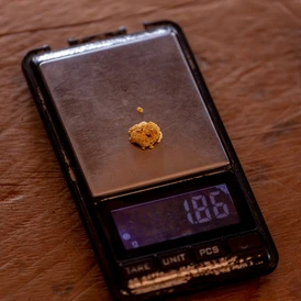 Gold is weighed on a scale