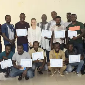 Participants holding their certificates after completing the workshop
