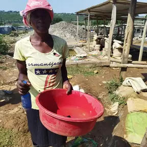 Kenyan woman miner with red bowl