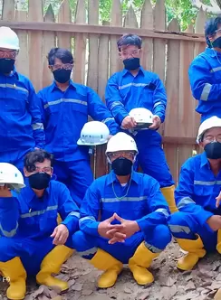 Miners in West Lombok, Indonesia using PPE at mining location