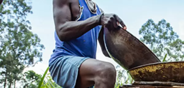 Kenyan miner with pan