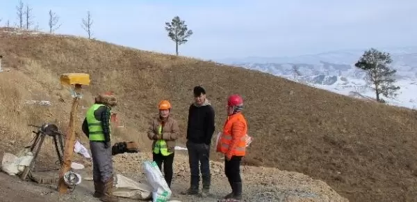 Miners by a secured shaft, Bulag-1 site, Selenge province, Mongolia