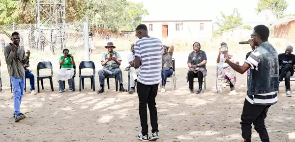 The Big Team Music performing one their songs during an engagement