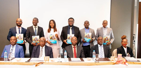Stakeholders posing for a group photo with the Contextual Study Report