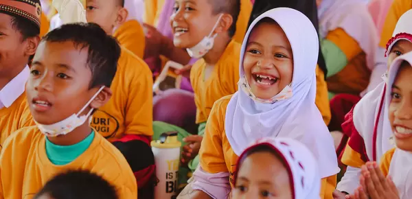 Students in Indonesia listening to stories on dangers of mercury