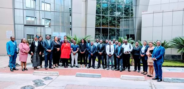 Financial institutions, stakeholders and the planetGOLD Team posing for photo after a succesful meeting