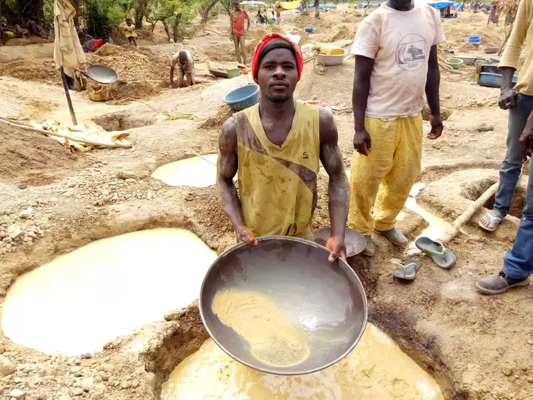 Panner in Burkina Faso artisanal gold mine