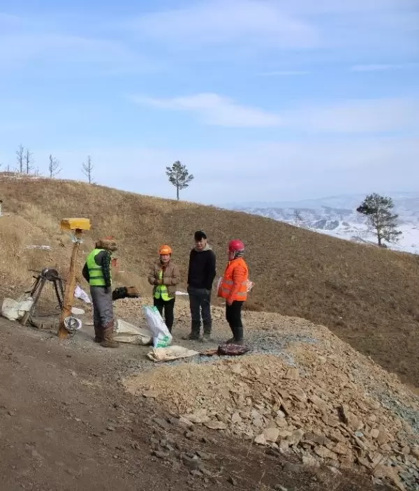 Miners by a secured shaft, Bulag-1 site, Selenge province, Mongolia