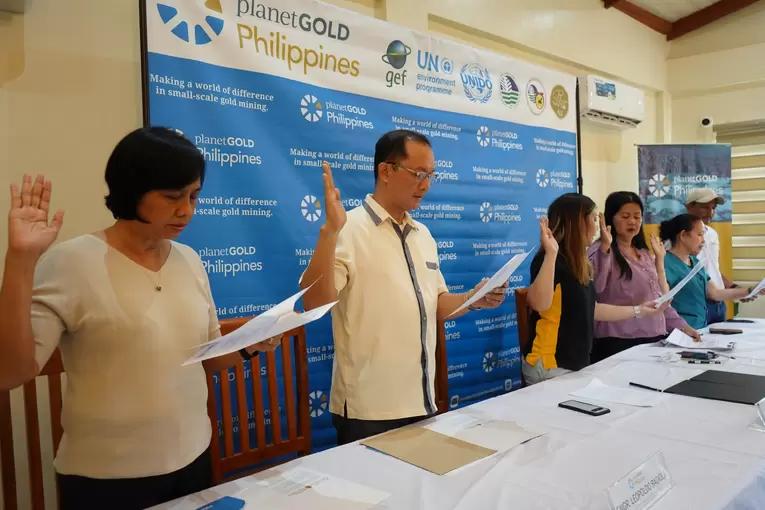 Attendees of the MOA signing ceremony join the collective pledge 2