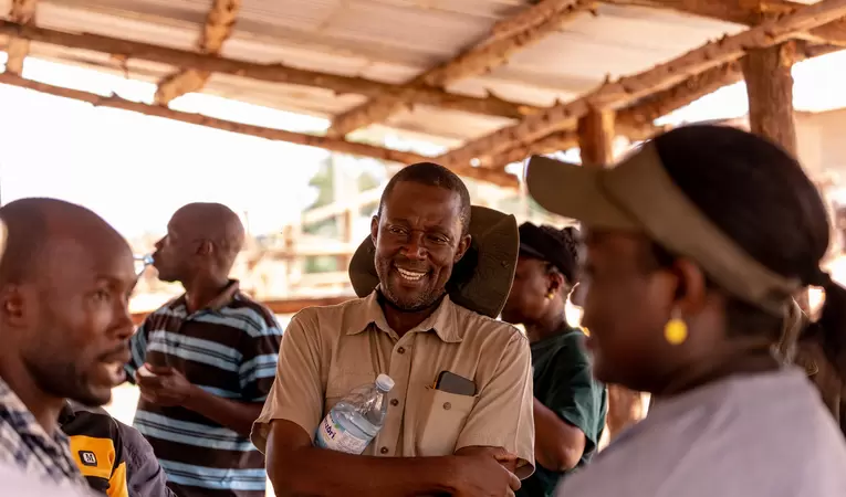 Staff listening to miners