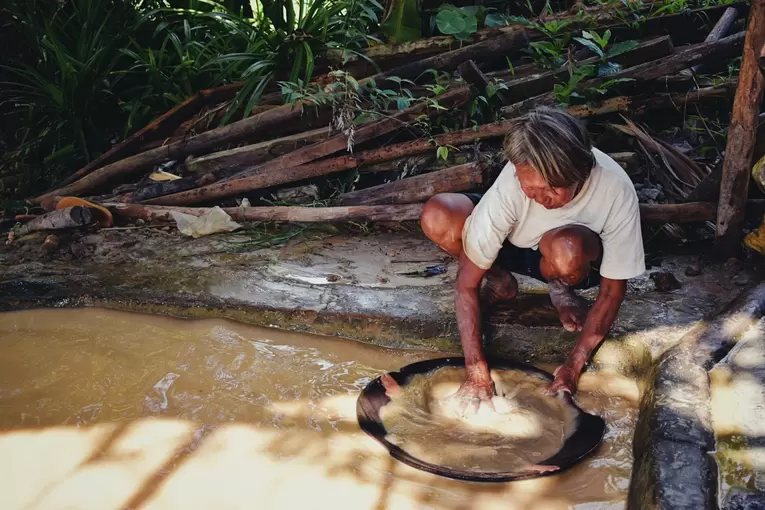 Woman panning for gold in Paracale, Camarines Norte